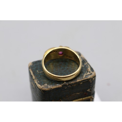 4 - Late 19th-century 18ct yellow gold ruby and diamond ring with scroll detailing, featuring one oval-c... 