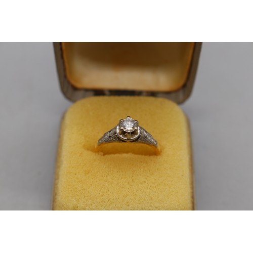13 - 18ct hallmarked diamond solitaire ring with a white gold head, set with a single round-cut diamond i... 