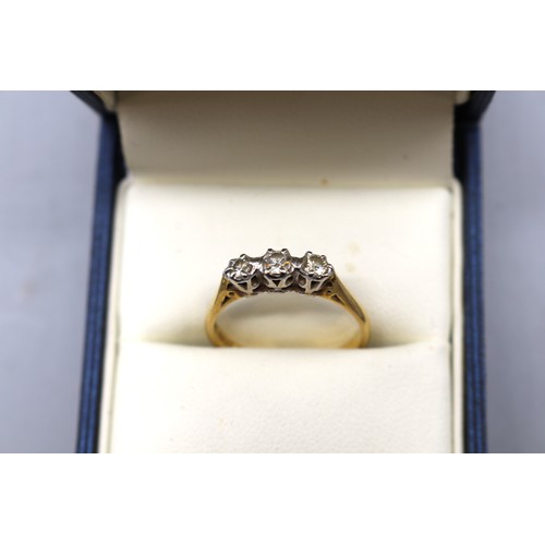 14 - Two mid century gold rings featuring 1x hallmarked 18ct yellow gold diamond trilogy ring approximate... 