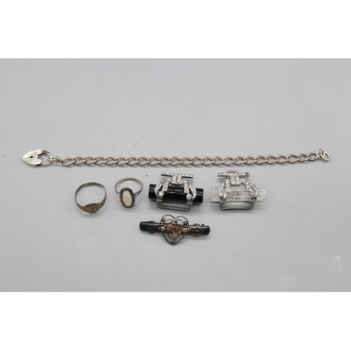 18 - Mixed silver and white metal items comprising a hallmarked silver curb link bracelet with padlock cl... 