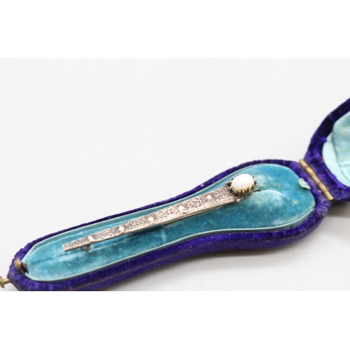 20 - Arts and Crafts Movement hammered brooch, thought to be 800 silver, set with opalite, accompanied by... 