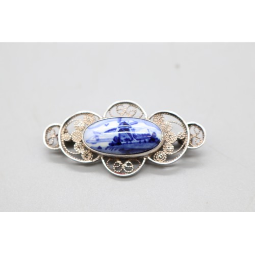20 - Arts and Crafts Movement hammered brooch, thought to be 800 silver, set with opalite, accompanied by... 