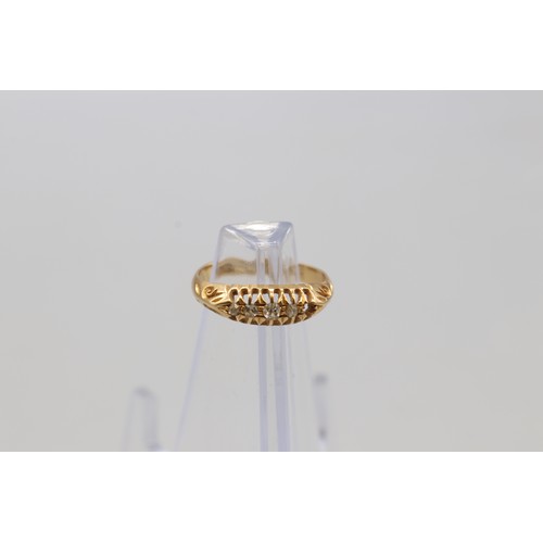 21 - A 5 stone claw set eternity ring stamped 18ct yellow gold with 5 diamond head note, 1 small diamond ... 