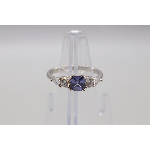 22 - Contemporary sterling silver five-stone ring set with tanzanite and cubic zirconia. Features a centr... 