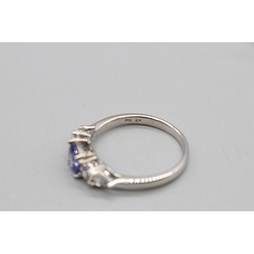 22 - Contemporary sterling silver five-stone ring set with tanzanite and cubic zirconia. Features a centr... 