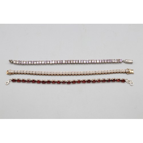 27 - Lot of three contemporary tennis bracelets comprising a two-tone gold-plated sterling silver diamond... 