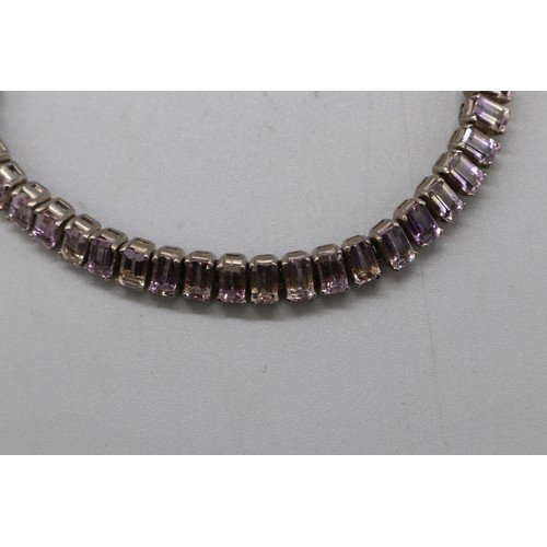 27 - Lot of three contemporary tennis bracelets comprising a two-tone gold-plated sterling silver diamond... 