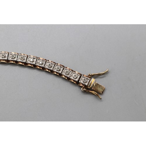 27 - Lot of three contemporary tennis bracelets comprising a two-tone gold-plated sterling silver diamond... 