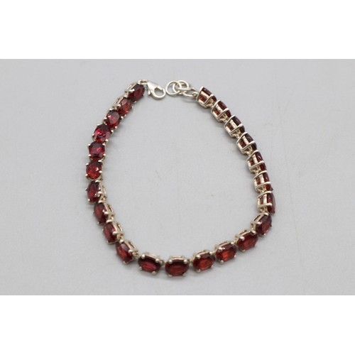 27 - Lot of three contemporary tennis bracelets comprising a two-tone gold-plated sterling silver diamond... 