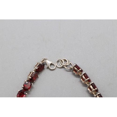 27 - Lot of three contemporary tennis bracelets comprising a two-tone gold-plated sterling silver diamond... 