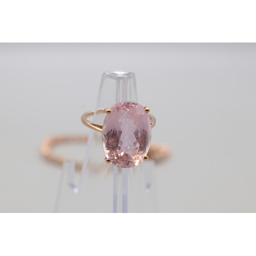 28 - Lot comprising a stamped contemporary 14ct rose gold four-claw-set large solitaire morganite ring, r... 