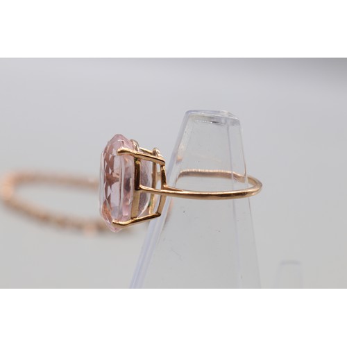 28 - Lot comprising a stamped contemporary 14ct rose gold four-claw-set large solitaire morganite ring, r... 