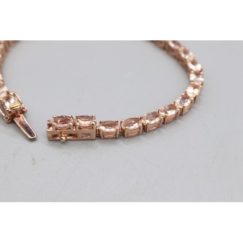 28 - Lot comprising a stamped contemporary 14ct rose gold four-claw-set large solitaire morganite ring, r... 