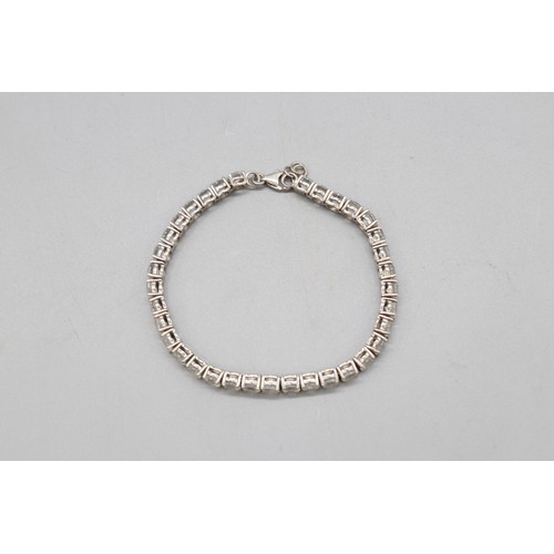 29 - Lot of three contemporary bracelets comprised of 1 round brilliant cut white topaz hallmarked sterli... 