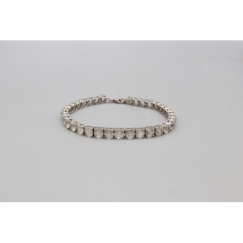 29 - Lot of three contemporary bracelets comprised of 1 round brilliant cut white topaz hallmarked sterli... 