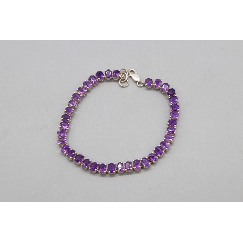 29 - Lot of three contemporary bracelets comprised of 1 round brilliant cut white topaz hallmarked sterli... 