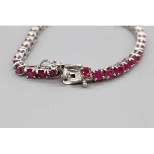 30 - Yellow and white metal oval cocktail ring set with a large vivid red-orange stone (colour resembling... 