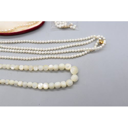 35 - Lot of pearl necklets comprising one individually strung graduating pearl necklet with graduating be... 
