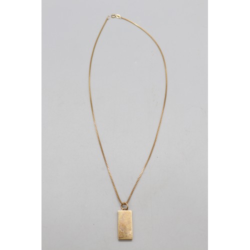 37 - 9ct yellow gold hallmarked 10g ingot pendant on a 9ct stamped yellow gold box chain, total weight 14... 