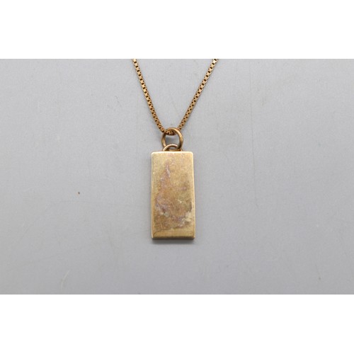 37 - 9ct yellow gold hallmarked 10g ingot pendant on a 9ct stamped yellow gold box chain, total weight 14... 