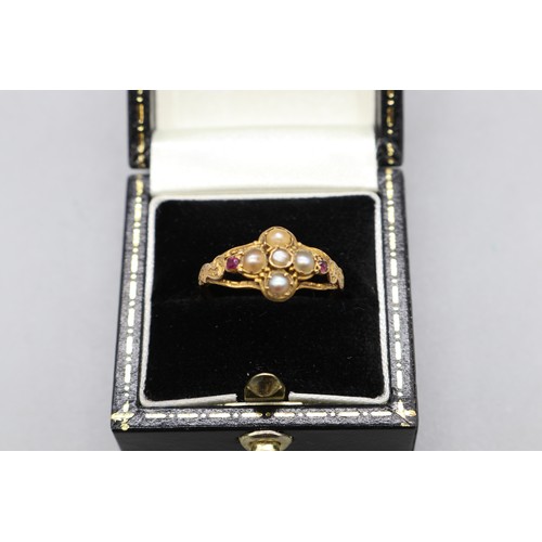 43 - Georgian yellow metal ring (hallmarks worn with age) set with seed pearls and rubies, featuring an i... 