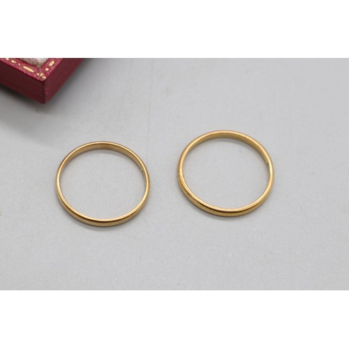 45 - Two 2mm gold wedding bands comprised of 1x 22ct hallmarked plain wedding band size Q, weight 2.1g an... 