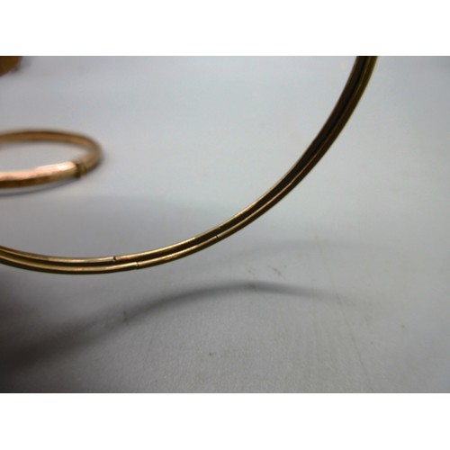 49 - Hallmarked 9ct rose gold engraved hinged bangle with safety chain, weight 6.19g; and a 9ct yellow go... 