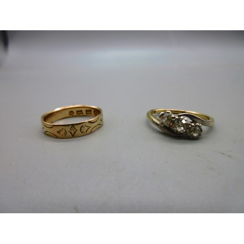 17 - Two 18ct yellow gold hallmarked rings comprising one twisted shank trilogy ring set with three round... 