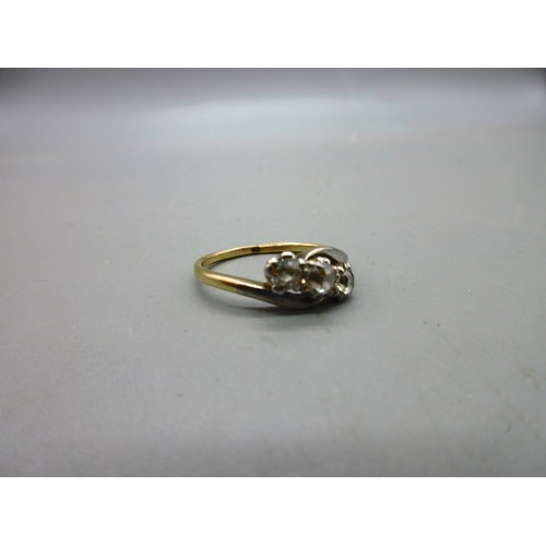 17 - Two 18ct yellow gold hallmarked rings comprising one twisted shank trilogy ring set with three round... 