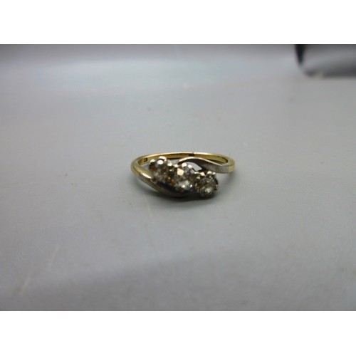 17 - Two 18ct yellow gold hallmarked rings comprising one twisted shank trilogy ring set with three round... 