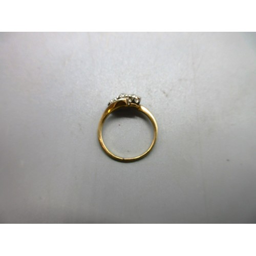 17 - Two 18ct yellow gold hallmarked rings comprising one twisted shank trilogy ring set with three round... 