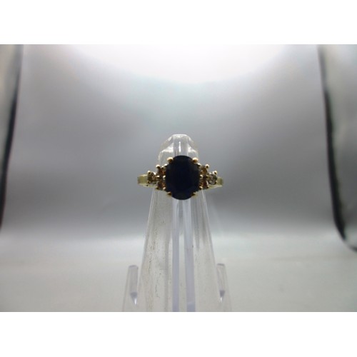 53 - Hallmarked 18ct yellow gold sapphire and diamond ring, 1 large oval faceted sapphire with trefoil 22... 