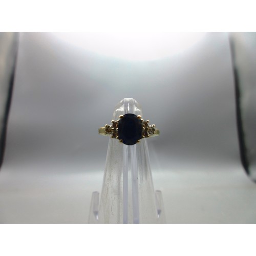 53 - Hallmarked 18ct yellow gold sapphire and diamond ring, 1 large oval faceted sapphire with trefoil 22... 