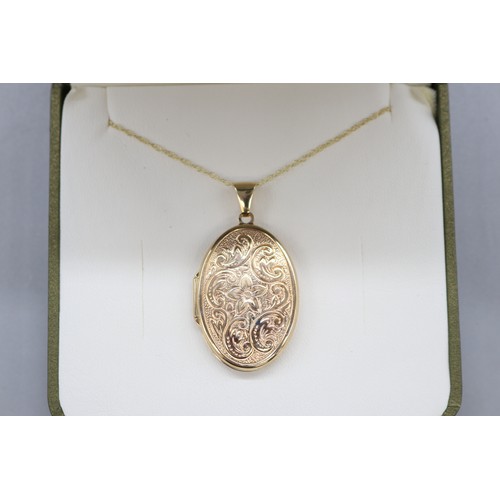 45 - 9ct yellow gold locket with scrollwork floral front on a fine double belcher rope chain, length 18