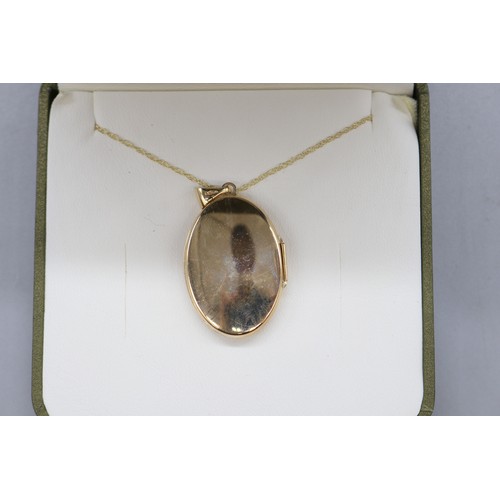 45 - 9ct yellow gold locket with scrollwork floral front on a fine double belcher rope chain, length 18