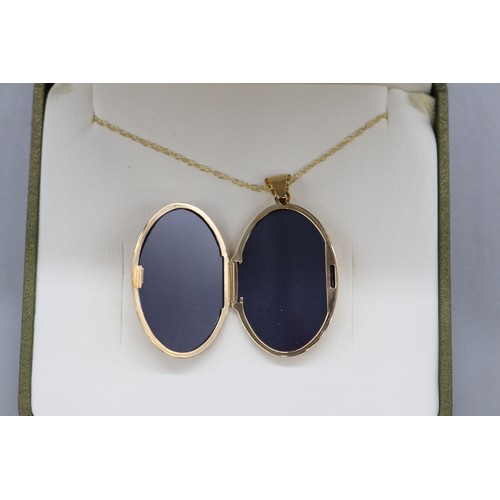 45 - 9ct yellow gold locket with scrollwork floral front on a fine double belcher rope chain, length 18