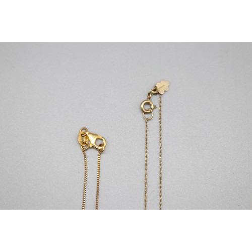 43 - Lot comprising two gold pendants and chains, including a stamped 14ct oval ruby and diamond halo pen... 