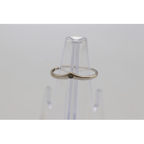 32 - Lot of three rings, comprising a white metal wishbone ring set with a small diamond, weight 0.87g, s... 