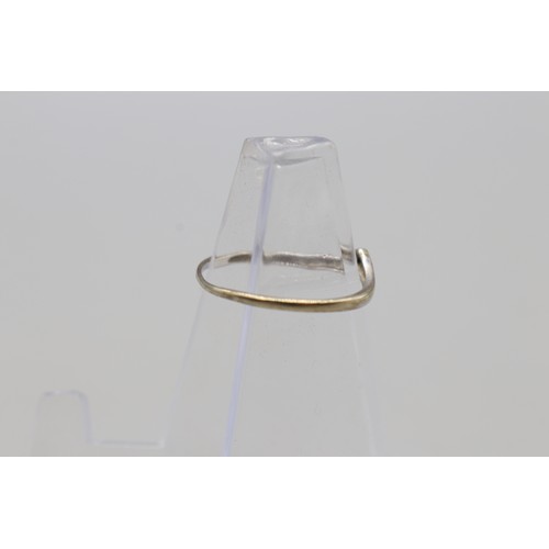 32 - Lot of three rings, comprising a white metal wishbone ring set with a small diamond, weight 0.87g, s... 