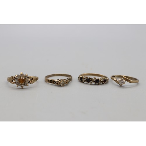29 - Lot of four hallmarked 9ct yellow gold rings, comprising a CZ solitaire ring with scrollwork shoulde... 