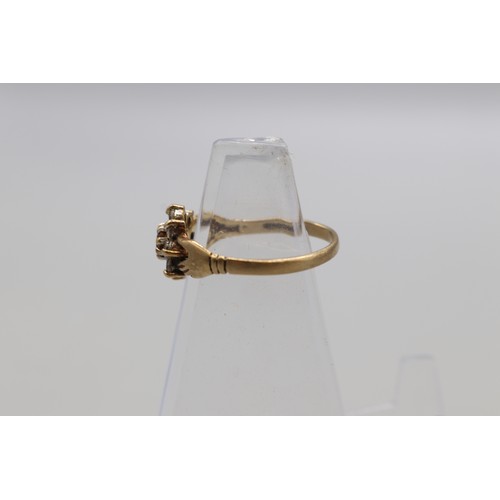 29 - Lot of four hallmarked 9ct yellow gold rings, comprising a CZ solitaire ring with scrollwork shoulde... 