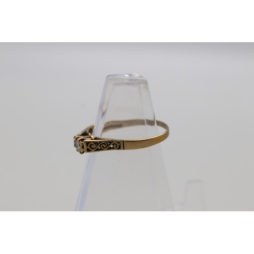 29 - Lot of four hallmarked 9ct yellow gold rings, comprising a CZ solitaire ring with scrollwork shoulde... 