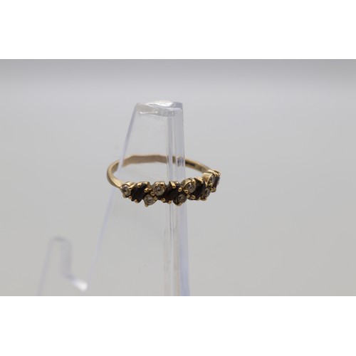 29 - Lot of four hallmarked 9ct yellow gold rings, comprising a CZ solitaire ring with scrollwork shoulde... 