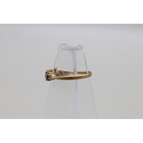 29 - Lot of four hallmarked 9ct yellow gold rings, comprising a CZ solitaire ring with scrollwork shoulde... 