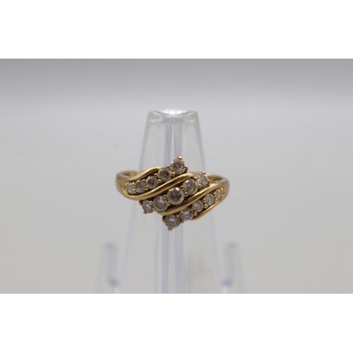 27 - Three hallmarked 9ct yellow gold cubic zirconia cluster rings, comprising a hexagonal flower cluster... 