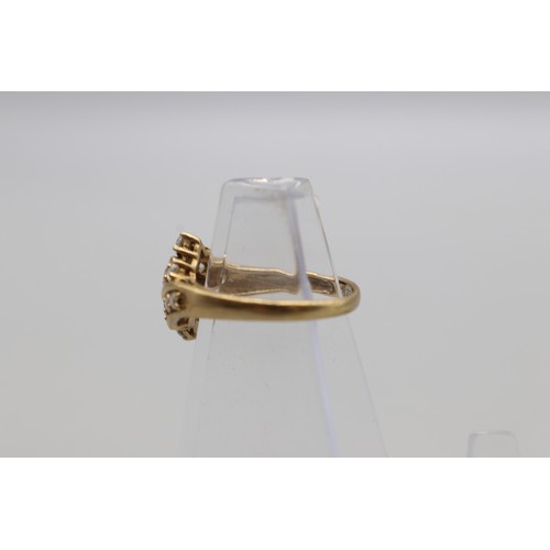 27 - Three hallmarked 9ct yellow gold cubic zirconia cluster rings, comprising a hexagonal flower cluster... 