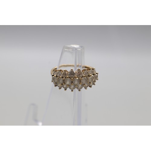 27 - Three hallmarked 9ct yellow gold cubic zirconia cluster rings, comprising a hexagonal flower cluster... 