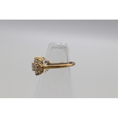 27 - Three hallmarked 9ct yellow gold cubic zirconia cluster rings, comprising a hexagonal flower cluster... 