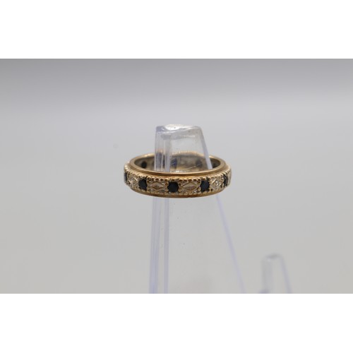 23 - Two stone-set full band rings, comprising a stamped 9ct sapphire and diamond full eternity ring with... 