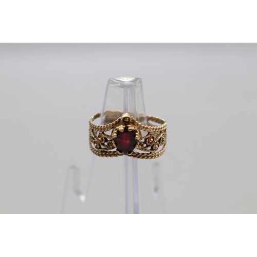 22 - Hallmarked 9ct yellow gold oval garnet wishbone ring with scrollwork, weight 3.38g, size T
Bradley's... 